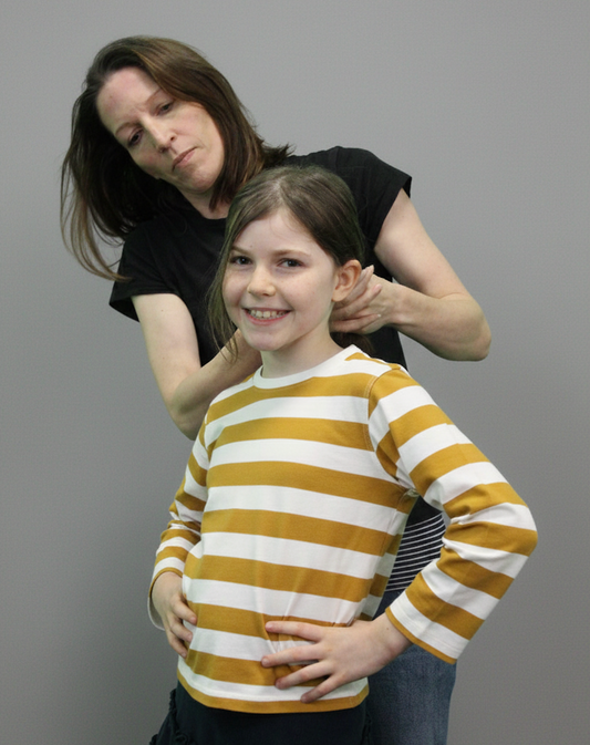 child and mother with sensory issues getting dressed