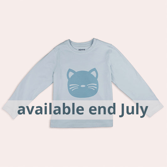 Light blue long-sleeve shirt with cat face design and text 'available end July' 